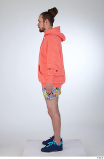 Nigel a-pose blue sneakers dressed floral printed shorts salmon hoodie…